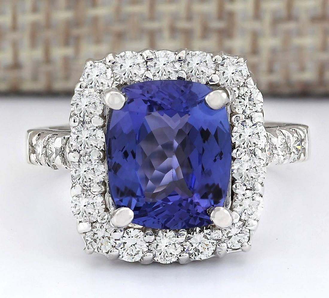 4.95 CTW Natural Blue Tanzanite And Diamond Ring 14k Solid White Gold: 4.95 CTW Natural Blue Tanzanite And Diamond Ring 14k Solid White Gold Manufacturer's Suggested Retail Price: $ 5300.00 Stamped: 14K Ring Size: 5.75 Total Ring Weight: 7.3 Grams Diamond Weight: Total N