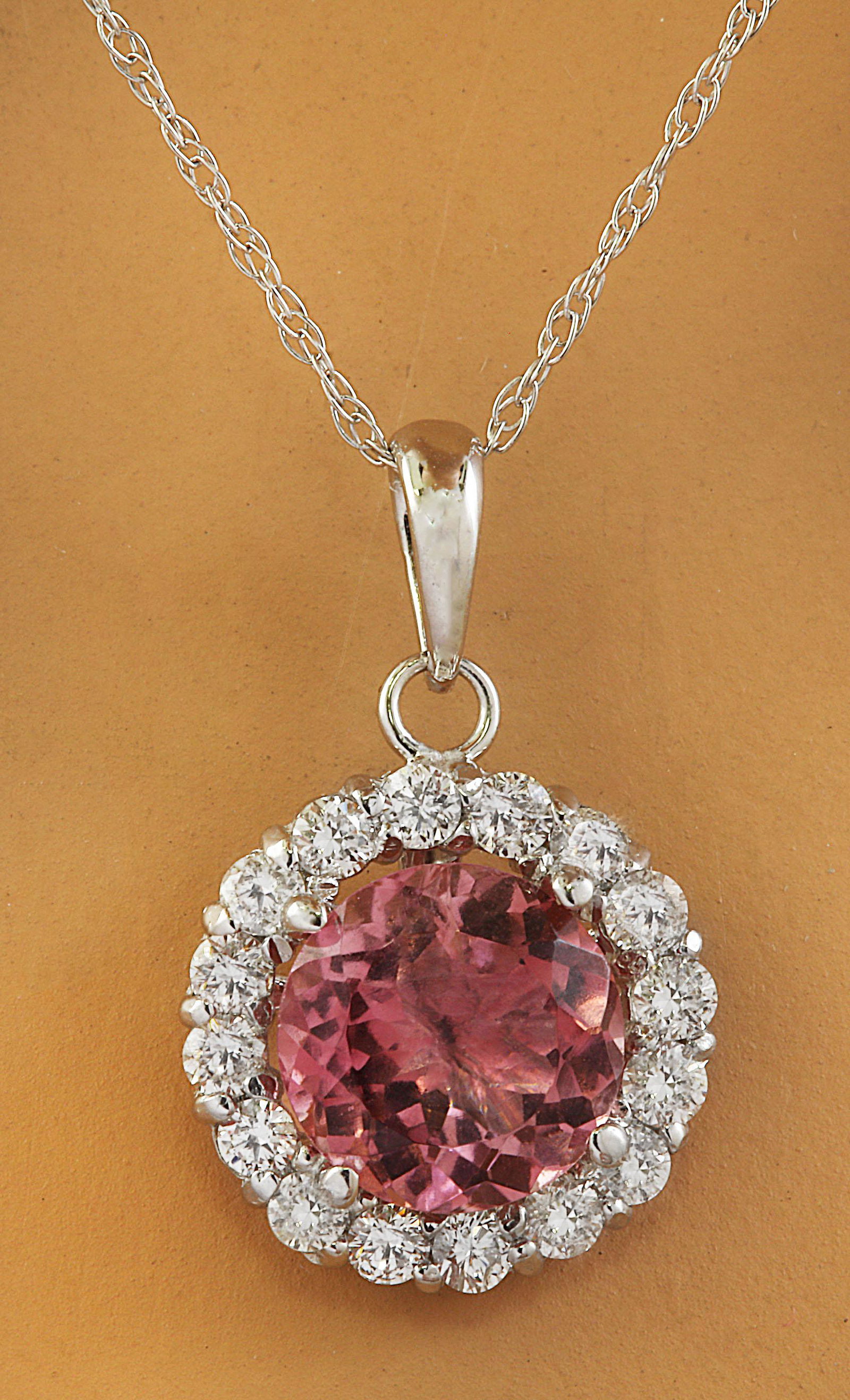 1.82 CTW Tourmaline 18K White Gold Diamond Necklace: 1.82 CTW Tourmaline 18K White Gold Diamond Necklace Manufacturer's Suggested Retail Price: $ 2100.00 Stamped: 18K Total Necklace Weight: 0.90 Grams Necklace Length 18 Inches Tourmaline Weight: 1.50 Ca