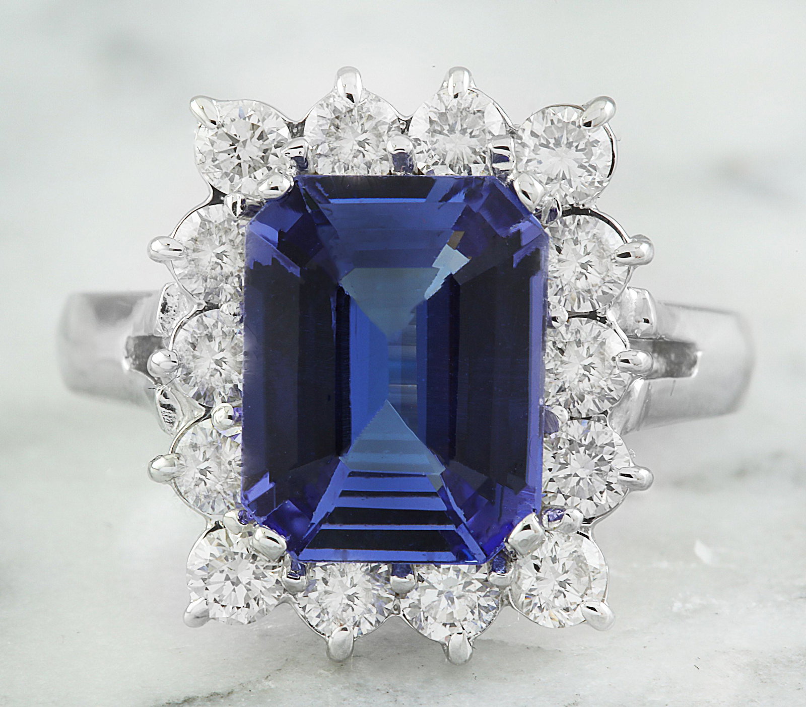 5.06 CTW Tanzanite 18K White Gold Diamond Ring: 5.06 CTW Tanzanite 18K White Gold Diamond Ring Manufacturer's Suggested Retail Price: $ 5500.00 Stamped: 18K Total Ring Weight: 5.5 Grams Tanzanite Weight 3.91 Carat (11.00x8.50 Millimeters) Diamond W