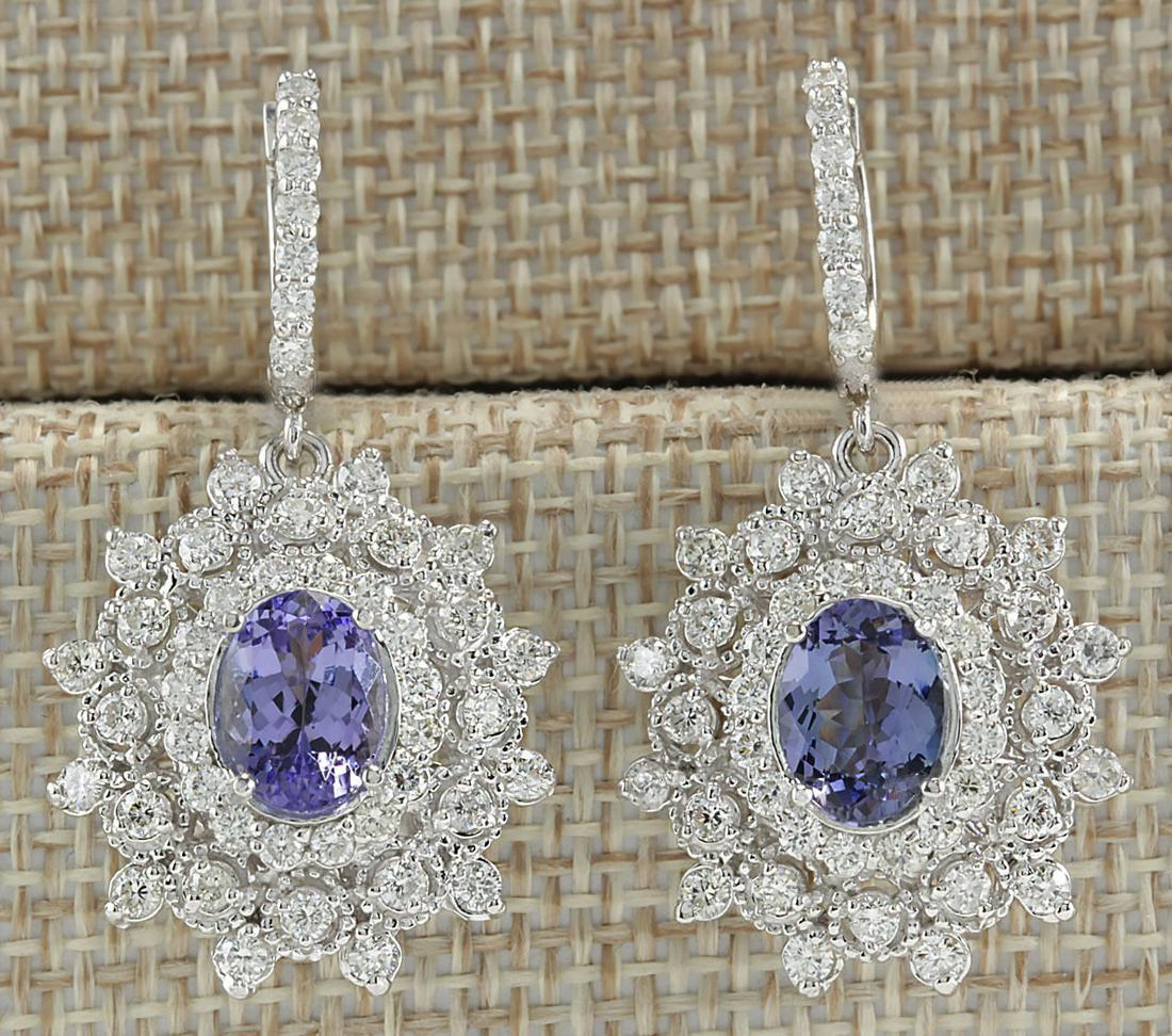 5.50 CTW Natural Tanzanite And Diamond Earrings 14K Solid White Gold: 5.50 CTW Natural Tanzanite And Diamond Earrings 14K Solid White Gold Manufacturer's Suggested Retail Price: $ 6900.00 Stamped: 14K Total Earring Weight: 11Grams Lenght: 1.50 inches Diamond Weight: Tot