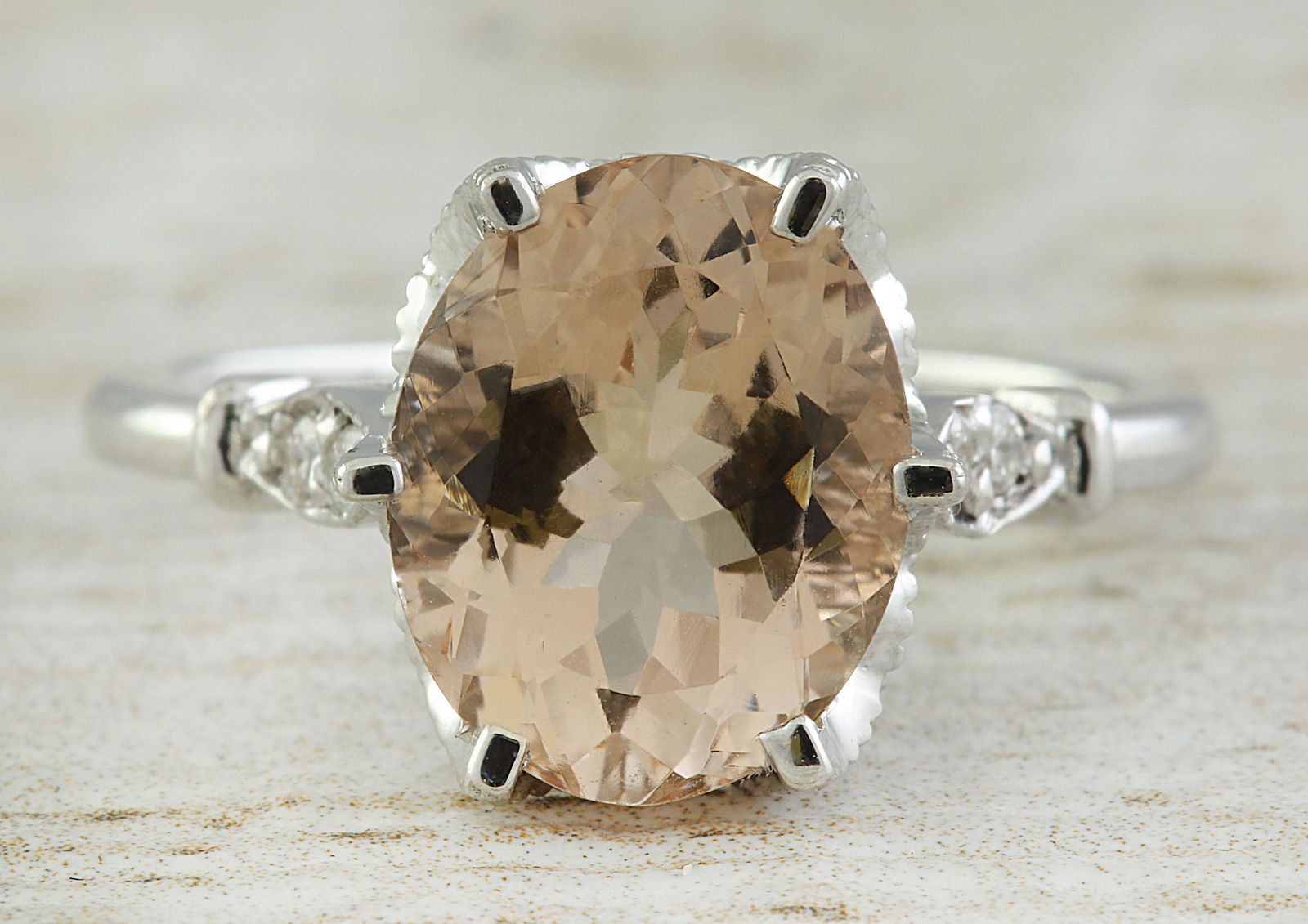 3.41 CTW Morganite 18K White Gold Diamond Ring: 3.41 CTW Morganite 18K White Gold Diamond Ring Manufacturer's Suggested Retail Price: $ 2700.00 Stamped: 18K Total Ring Weight: 4.2 Grams Morganite Weight: 3.26 Carat (11.00x9.00 Millimeters) Diamond