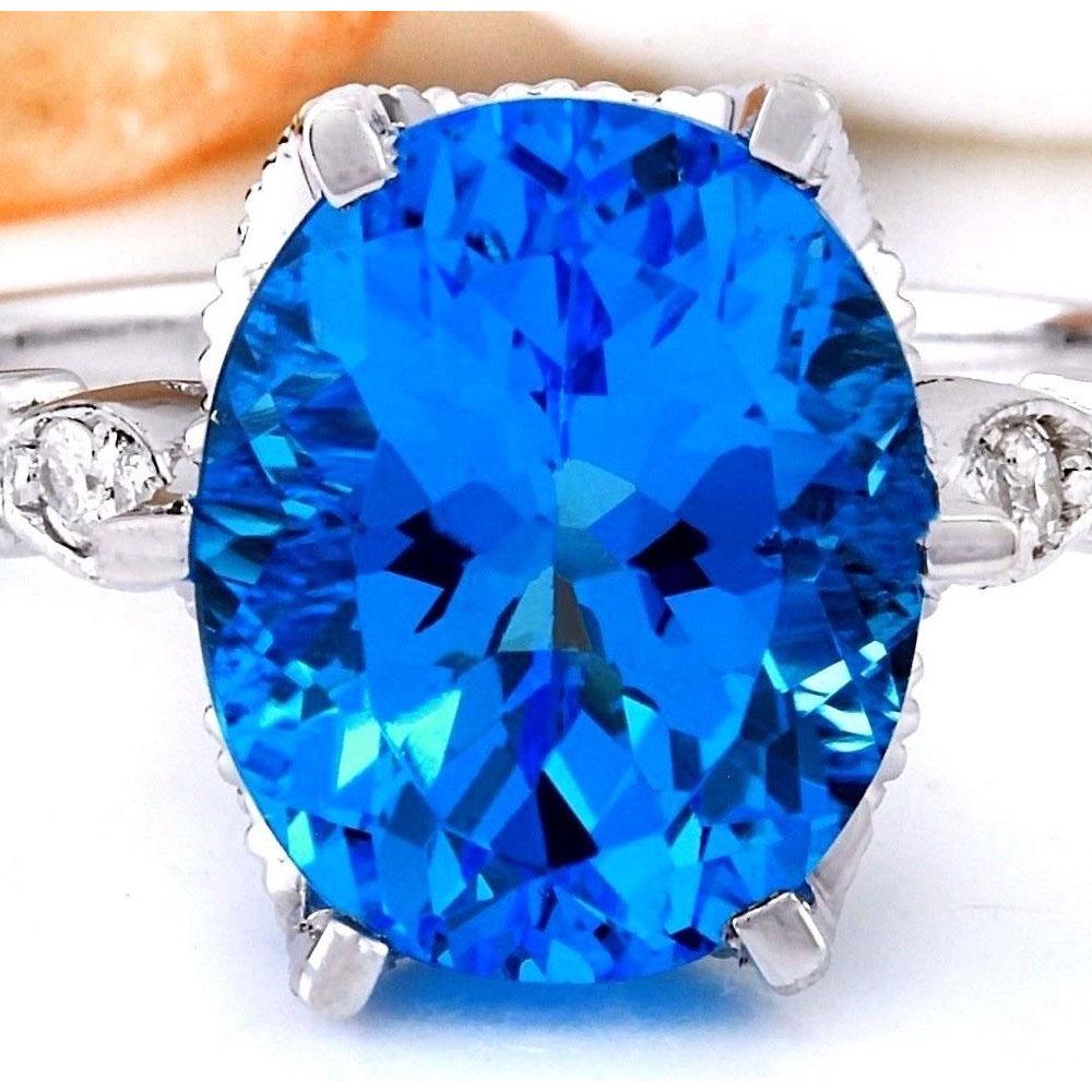 4.95 CTW Natural Topaz 18K Solid White Gold Diamond Ring: 4.95 CTW Natural Topaz 18K Solid White Gold Diamond Ring Manufacturer's Suggested Retail Price: $ 1900.00 4.95 Carat Natural Topaz 18K Solid White Gold Diamond Ring Item Type: Ring Item Style: Cocktai
