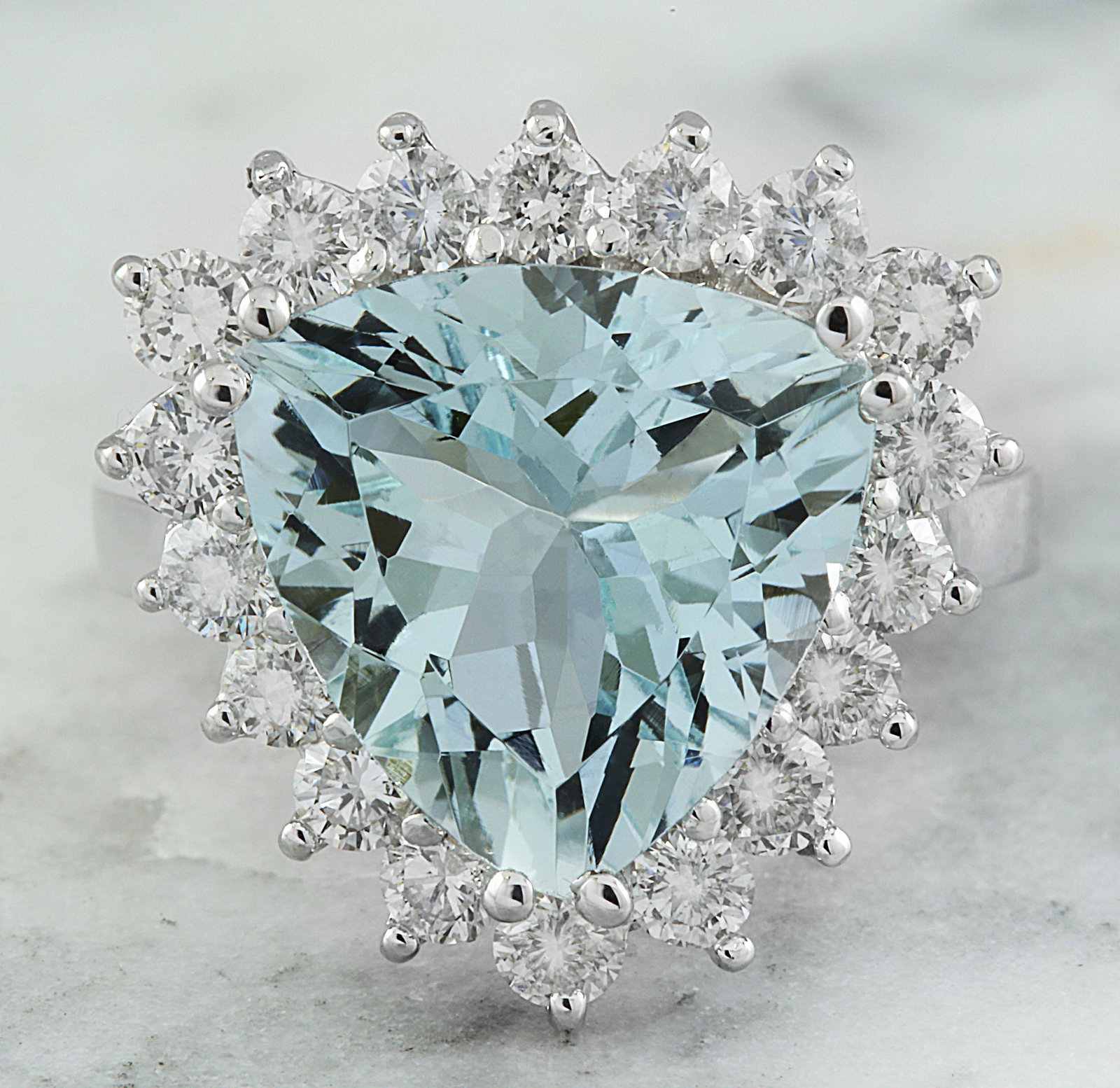 7.12 CTW Aquamarine 18K White Gold Diamond Ring: 7.12 CTW Aquamarine 18K White Gold Diamond Ring Manufacturer's Suggested Retail Price: $ 4700.00 Stamped: 18K Total Ring Weight: 5.5 Grams Aquamarine Weight 6.07 Carat (12.00x12.00 Millimeters) Diamon