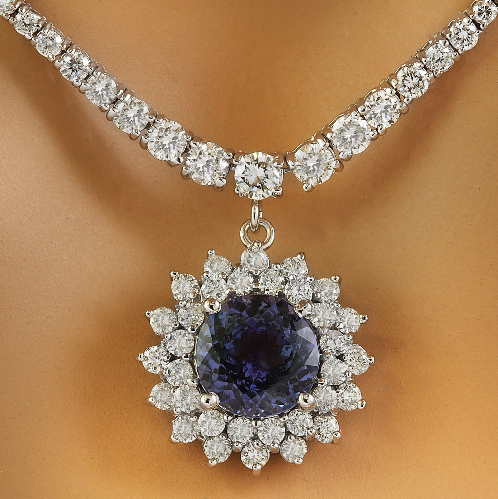 9.05 CTW Tanzanite 18K White Gold Diamond Necklace: 9.05 CTW Tanzanite 18K White Gold Diamond Necklace Manufacturer's Suggested Retail Price: $ 15700.00 Stamped: 18K Total Necklace Weight: 21.9 Grams Necklace Length: 16.5 Inches Tanzanite Weight: 4.03 