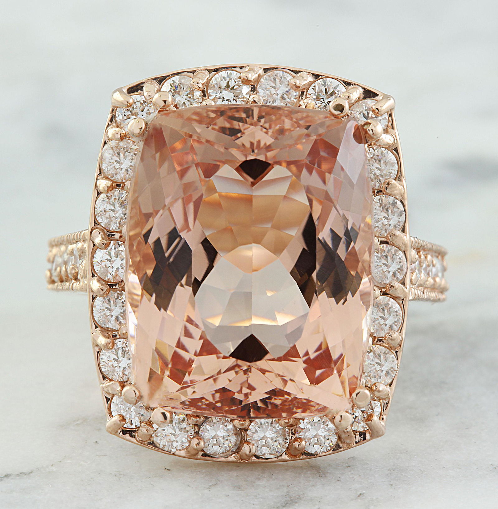 14.90 CTW Morganite 18K Rose Gold Diamond Ring: 14.90 CTW Morganite 18K Rose Gold Diamond Ring Manufacturer's Suggested Retail Price: $ 6600.00 Stamped: 18K Total Ring Weight: 10 Grams Morganite Weight: 13.80 Carat (16.20x12.80 Millimeters) Diamond
