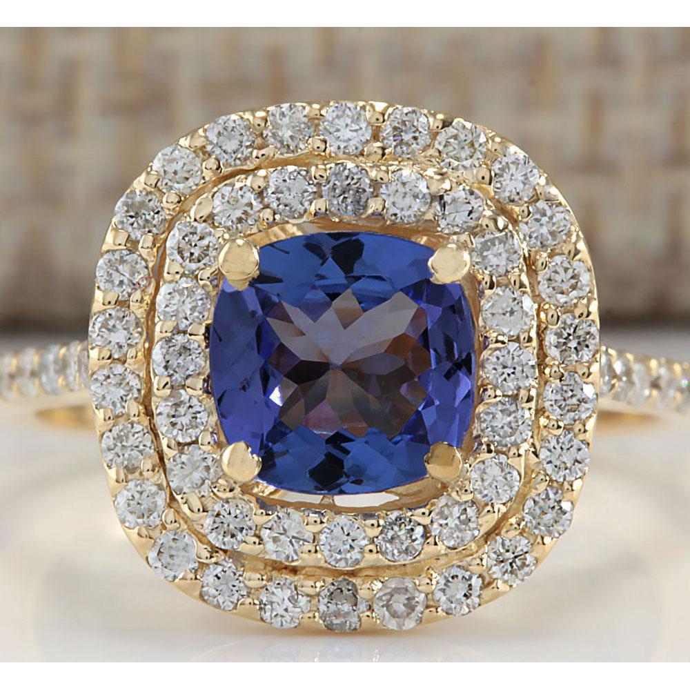 2.00 CTW Natural Blue Tanzanite And Diamond Ring 18K Solid Yellow Gold: 2.00 CTW Natural Blue Tanzanite And Diamond Ring 18K Solid Yellow Gold Manufacturer's Suggested Retail Price: $ 3200.00 Stamped: 18K Ring Size: 5.5 Total Ring Weight: 3.3 Grams Diamond Weight: Total N