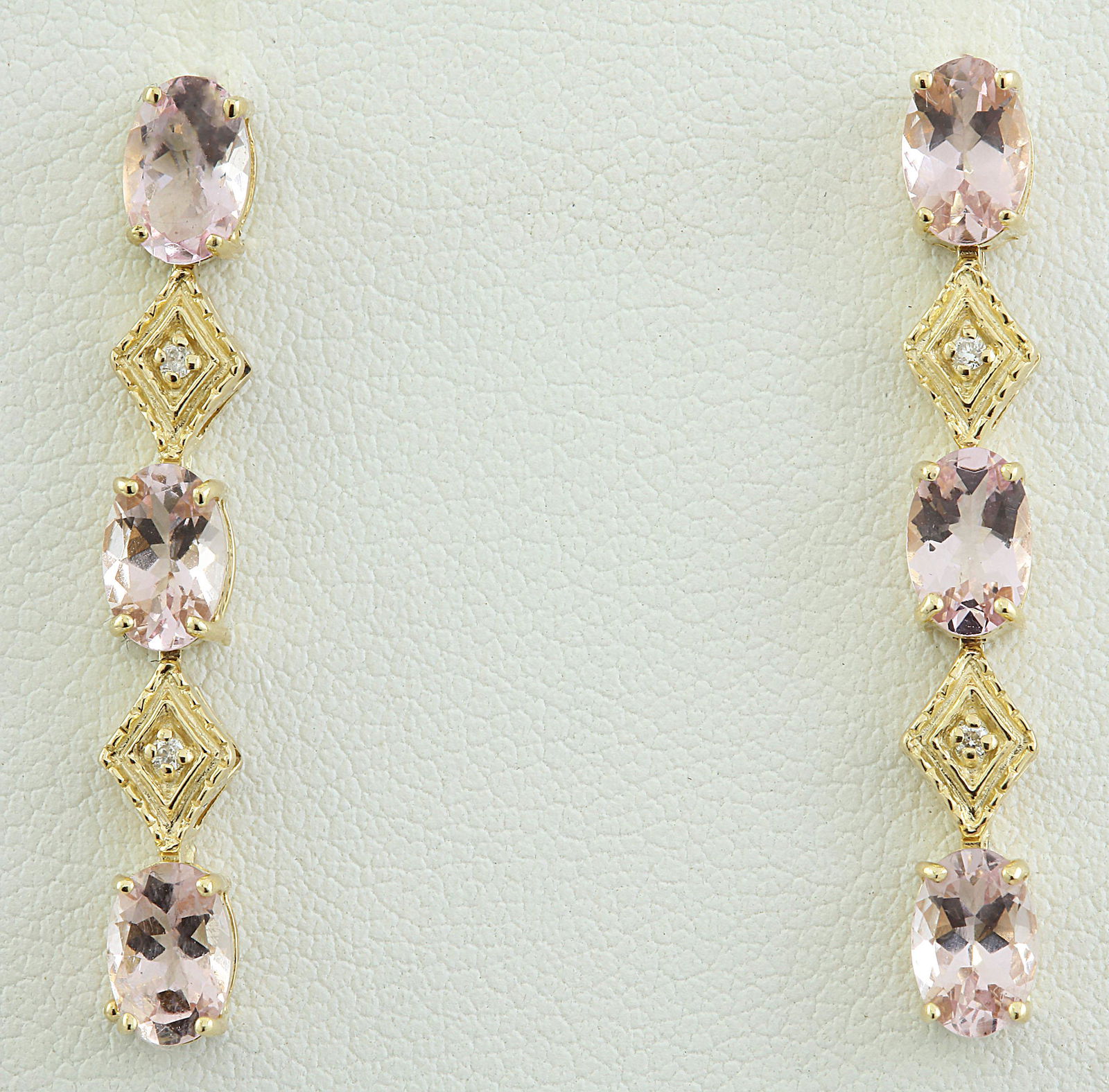 2.65 CTW Morganite 14K Yellow Gold Diamond Earrings: 2.65 CTW Morganite 14K Yellow Gold Diamond Earrings Manufacturer's Suggested Retail Price: $ 1700.00 Stamped: 14K Total Earrings Weight: 1.6 Grams Morganite Weight: 2.60 Carat (6.00x4.00 Millimeters)