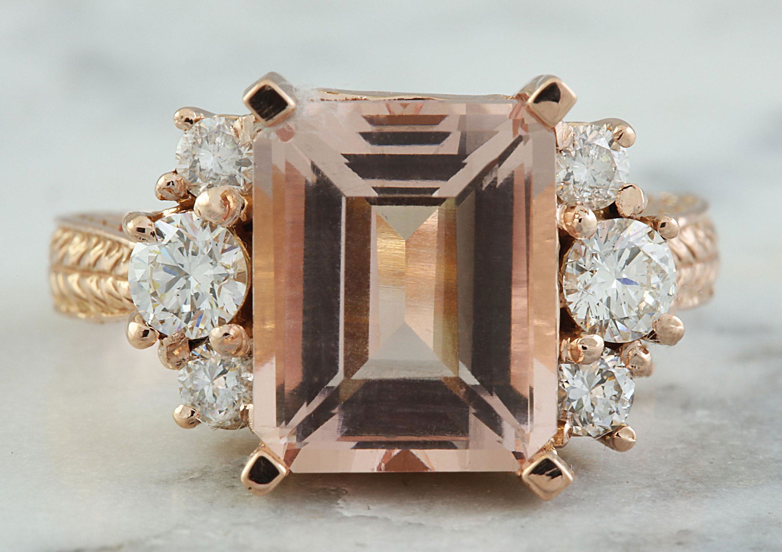 5.30 CTW Morganite 18K Rose Gold Diamond Ring: 5.30 CTW Morganite 18K Rose Gold Diamond Ring Manufacturer's Suggested Retail Price: $ 4100.00 Stamped: 18K Ring Size: 7 Total Ring Weight: 7.5 Grams Morganite Weight: 4.60 Carat (11.00x9.00 Millimete