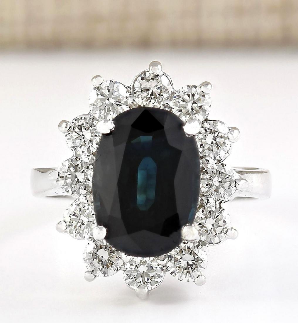 5.77 CTW Natural Blue Sapphire And Diamond Ring In 18K White Gold: 5.77 CTW Natural Blue Sapphire And Diamond Ring In 18K White Gold Manufacturer's Suggested Retail Price: $ 6600.00 Stamped: 18K Ring Size: 6.75 Total Ring Weight: 6.1 Grams Diamond Weight: Total Natur