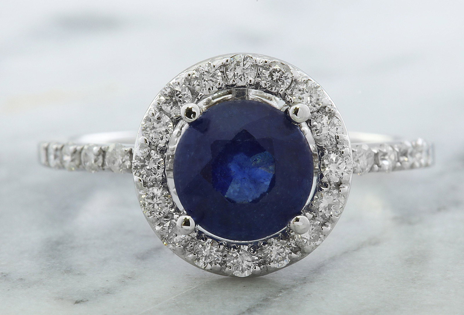 2.61 CTW Sapphire 18K White Gold Diamond Ring: 2.61 CTW Sapphire 18K White Gold Diamond Ring Manufacturer's Suggested Retail Price: $ 3000.00 Stamped: 18K Ring Size: 7 Total Ring Weight: 2.5 Grams Sapphire Weight: 2.01 Carat (7.00x7.00 Millimeter)