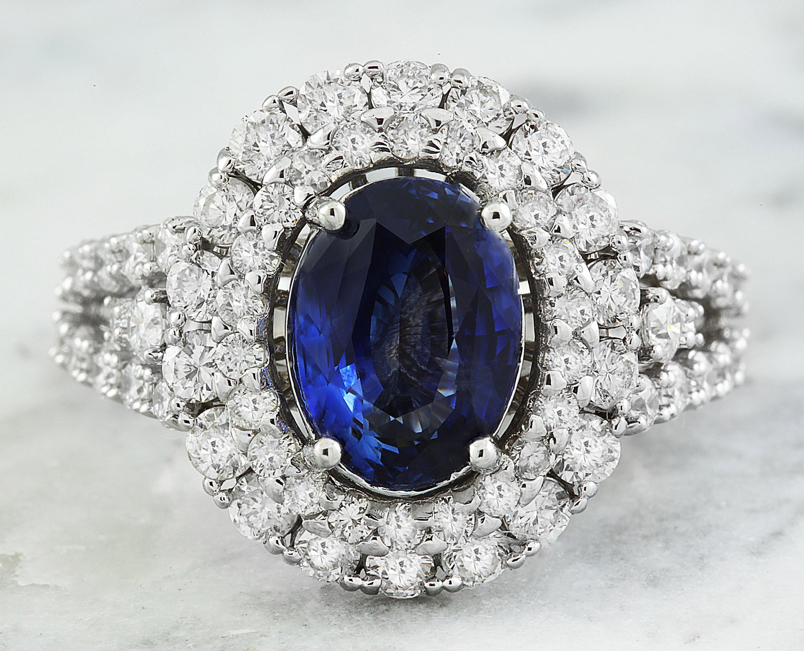 4.65 CTW Sapphire 18K White Gold Diamond Ring: 4.65 CTW Sapphire 18K White Gold Diamond Ring Manufacturer's Suggested Retail Price: $ 5700.00 Stamped: 18K Total Ring Weight: 6.3 Grams Sapphire Weight 2.85 Carat (9.85x7.25 Millimeters) Diamond Weig