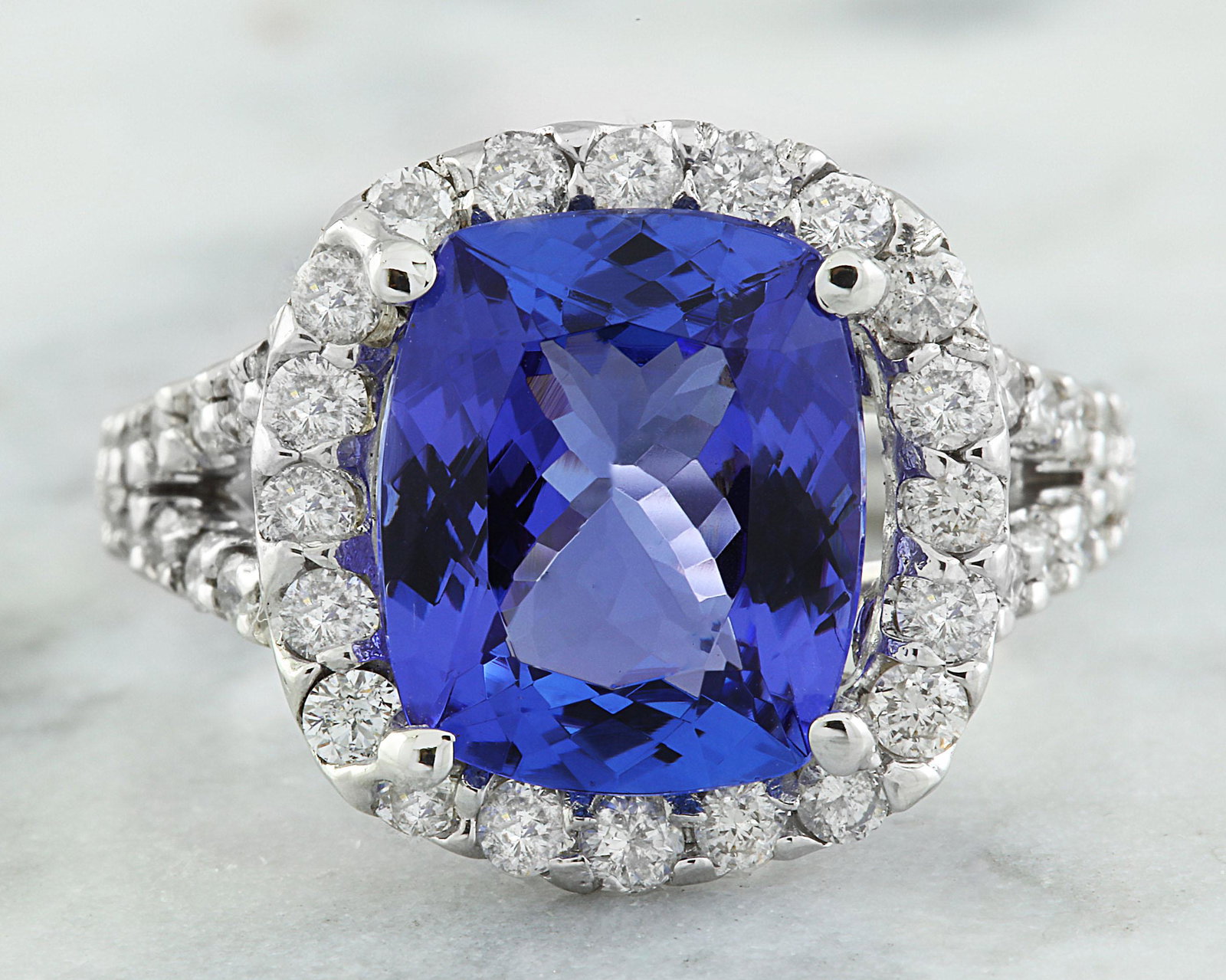 5.09 CTW Tanzanite 18K White Gold Diamond Ring: 5.09 CTW Tanzanite 18K White Gold Diamond Ring Manufacturer's Suggested Retail Price: $ 4400.00 Stamped: 18K Total Ring Weight: 5.8 Grams Tanzanite Weight: 4.00 Carat (10.80x9.00 Millimeters) Diamond 