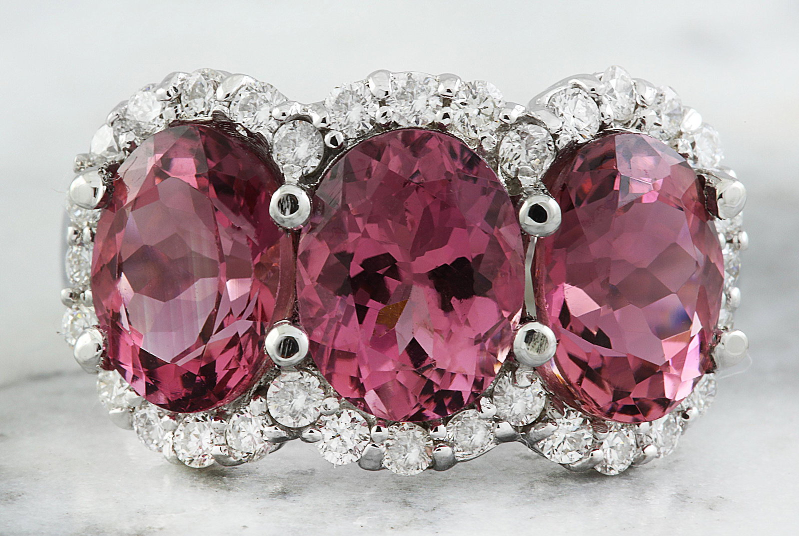 7.02 CTW Tourmaline 18K White Gold Diamond Ring: 7.02 CTW Tourmaline 18K White Gold Diamond Ring Manufacturer's Suggested Retail Price: $ 5400.00 Stamped: 18K Total Ring Weight: 9.1 Grams Tourmaline Weight 6.22 Carat (9.00x7.00 Millimeters) Diamond 