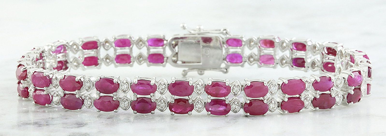 15.93 CTW Ruby 14K White Gold Diamond Bracelet: 15.93 CTW Ruby 14K White Gold Diamond Bracelet Manufacturer's Suggested Retail Price: $ 6000.00 Stamped: 585 Total Bracelet Weight: 18 Grams Bracelet Length: 7 Inches Ruby Weight: 15.08 Carat (5.00x3.