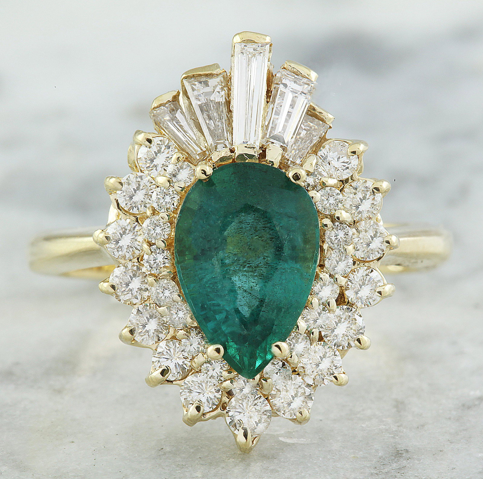 2.60 CTW Emerald 18K Yellow Gold Diamond Ring: 2.60 CTW Emerald 18K Yellow Gold Diamond Ring Manufacturer's Suggested Retail Price: $ 4300.00 Stamped: 18K Total Ring Weight: 5.6 Grams Emerald Weight 1.70 Carat (9.75x6.60 Millimeters) Diamond Weigh