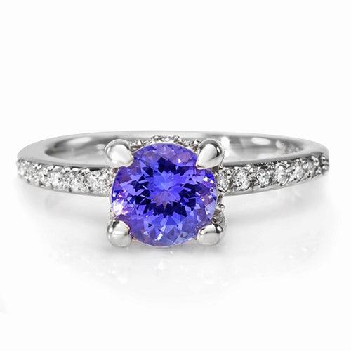 Natural Tanzanite & Diamond Ring 18K White Gold: Product Type: Ring Size: 7 Sizing lower range: 4 Sizing upper range: 12 Gender: Ladies Country of Origin: US Setting Type: Prong Main Gemstone name: Tanzanite Main Gemstone color