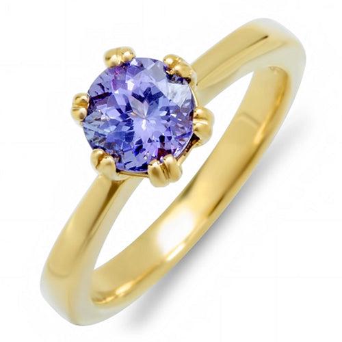 Natural Tanzanite Ring 18K Yellow Gold: Product Type: Ring Size: 7 Sizing lower range: 4 Sizing upper range: 12 Gender: Ladies Country of Origin: US Setting Type: Prong Main Gemstone name: Tanzanite Main Gemstone color