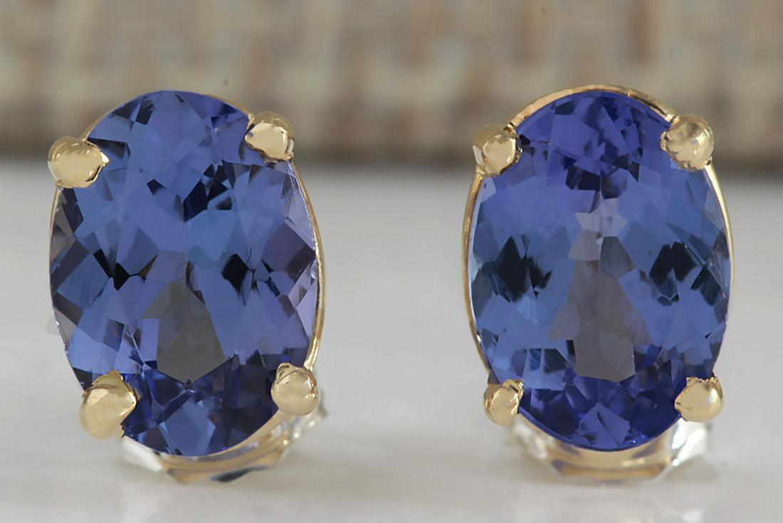 Natural 2.00 CT Tanzanite Earrings 18K Yellow Gold: Stamped: 18K Yellow Gold Total Earrings Weight: 1.3 Grams Earrings Length: 0.30 Inches Earrings Width: 5.65 mm Gemstone Weight: Total Natural Tanzanite Weight is 2.00 Carat Megerments: 7.00X5.00 mm