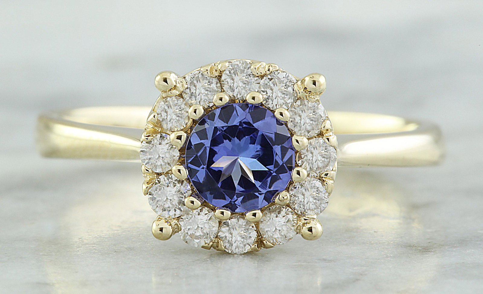 0.72 Carat Tanzanite 14K Yellow Gold Diamond Ring: Stamped: 14K Total Ring Weight: 2.9 Grams Tanzanite Weight: 0.50 Carat (5.50x5.50 Millimeters) Diamond Weight: 0.22 carat (F-G Color, VS2-SI1 Clarity ) Face Measures: 8.85x8.85 Millimeter SKU: [600333