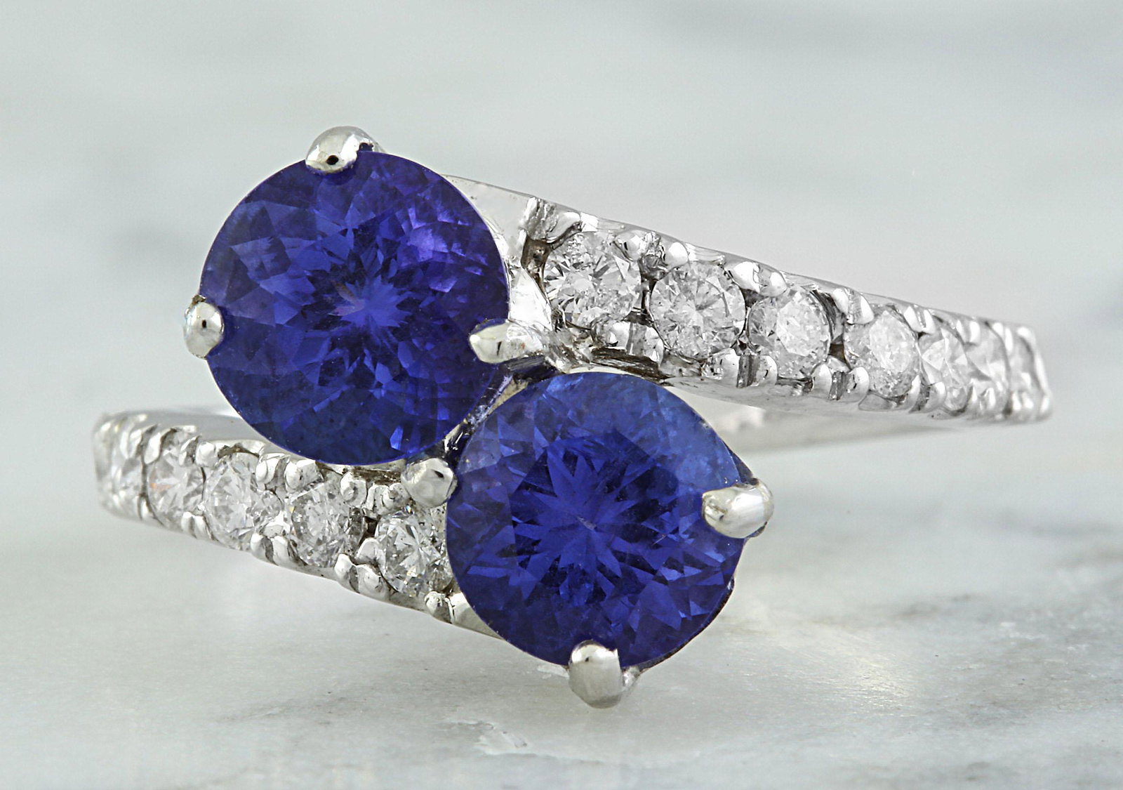 2.52 Carat Tanzanite 14K White Gold Diamond Ring: Stamped: 14K Ring Size: 7 Total Ring Weight: 4.9 Grams Tanzanite Weight: 2.12 Carat (6.20x6.20 Millimeter) Diamond Weight: 0.40 Carat (F-G Color, VS2-SI1 Clarity Face Measures: 12.65x11.35 Millimeter 