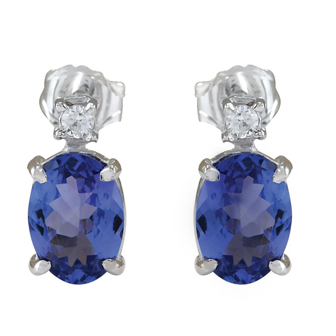 1.73 Carat Tanzanite 18K White Gold Diamond Earrings: 1.73 Carat Tanzanite 18K White Gold Diamond Earrings Stamped: 18K White Gold Total Earrings Weight: 1.4 Grams Earrings Length: 0.39 Inches Earrings Width: 5.13 mm Gemstone Weight: Total Natural Tanzan