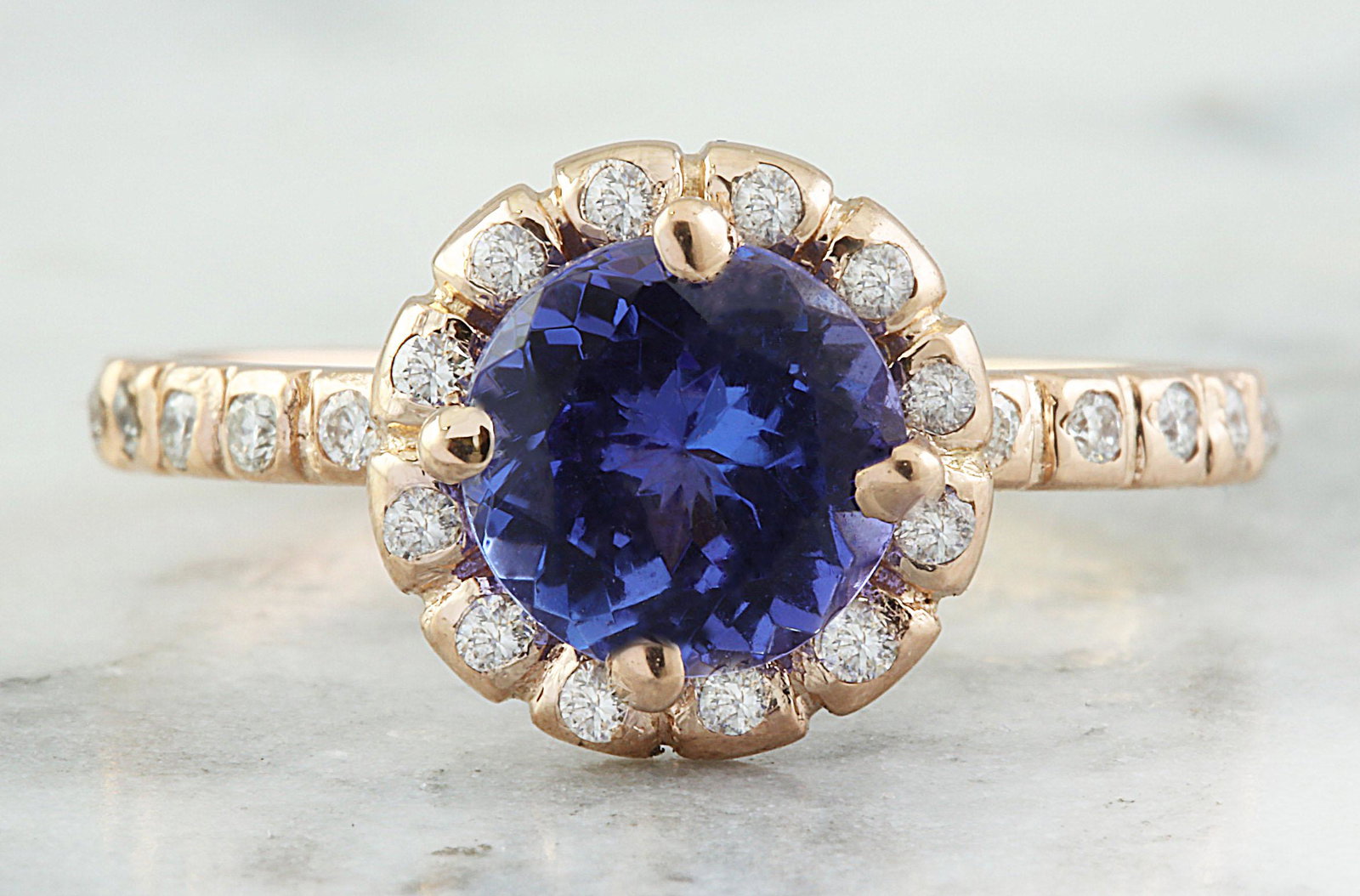 1.44 Carat Tanzanite 18K Rose Gold Diamond Ring: 1.44 Carat Tanzanite 18K Rose Gold Diamond Ring Stamped: 18K Total Ring Weight: 3 Grams Tanzanite Weight 1.20 Carat (7.00x7.00 Millimeters) Diamond Weight: 0.24 carat (F-G Color, VS2-SI1 Clarity ) Fac