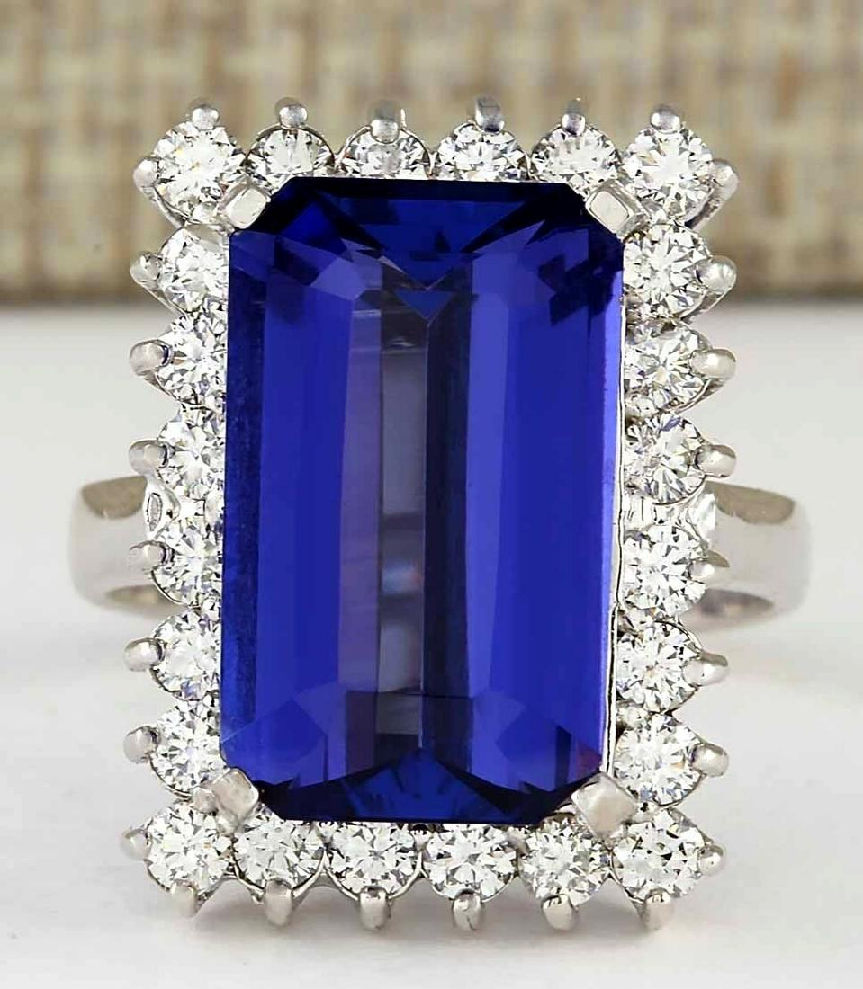 9.05 Carat Natural Blue Tanzanite And Diamond Ring 18K Solid White Gold: 9.05 Carat Natural Blue Tanzanite And Diamond Ring 18K Solid White Gold Stamped: 18K Ring Size: 6.75 Total Ring Weight: 9 Grams Diamond Weight: Total natural diamond weight is 1.15carat. VS2-SI1 clari