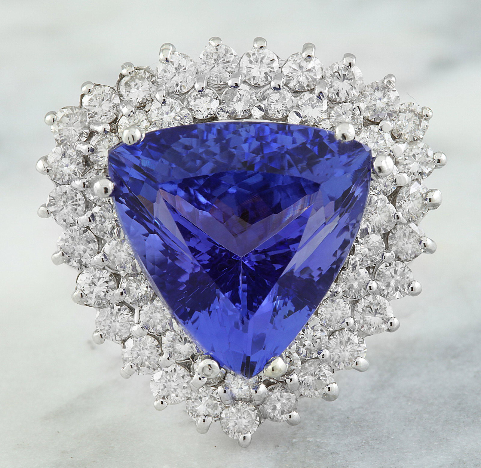 12.72 Carat Tanzanite 14K White Gold Diamond Ring: 12.72 Carat Tanzanite 14K White Gold Diamond Ring Stamped: 14K Ring Size: 7 Total Ring Weight: 11.1 Grams Tanzanite Weight: 10.62 Carat (17.00x14.00 Millimeter) Diamond Weight: 2.10 Carat (F-G Color, 