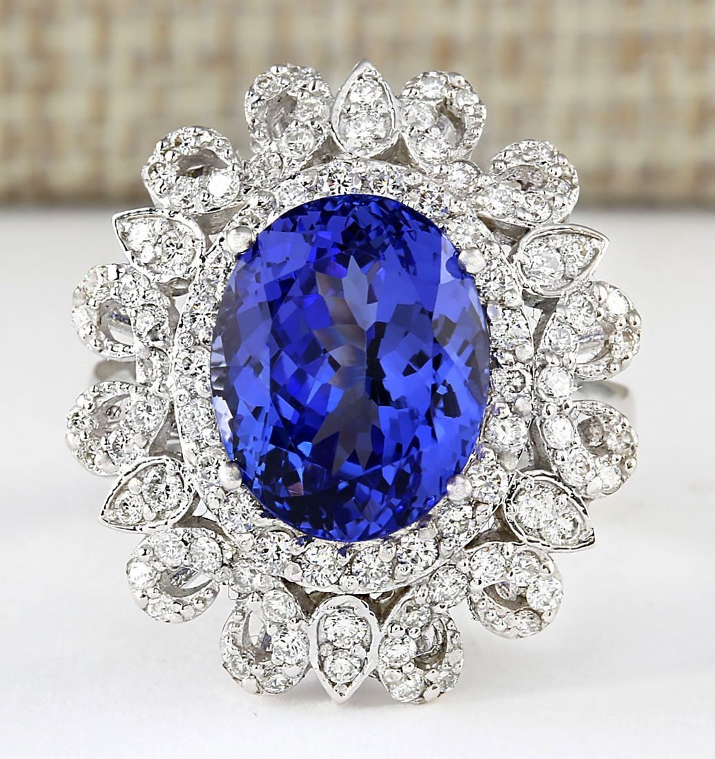 6.97 Carat Natural Tanzanite And Diamond Ring In 14k White Gold: 6.97 Carat Natural Tanzanite And Diamond Ring In 14k White Gold Stamped: 14K Ring Size: 6.75 Total Ring Weight: 8.5 Grams Diamond Weight: Total natural diamond weight is 1.00carat. VS2-SI1 clarity / G
