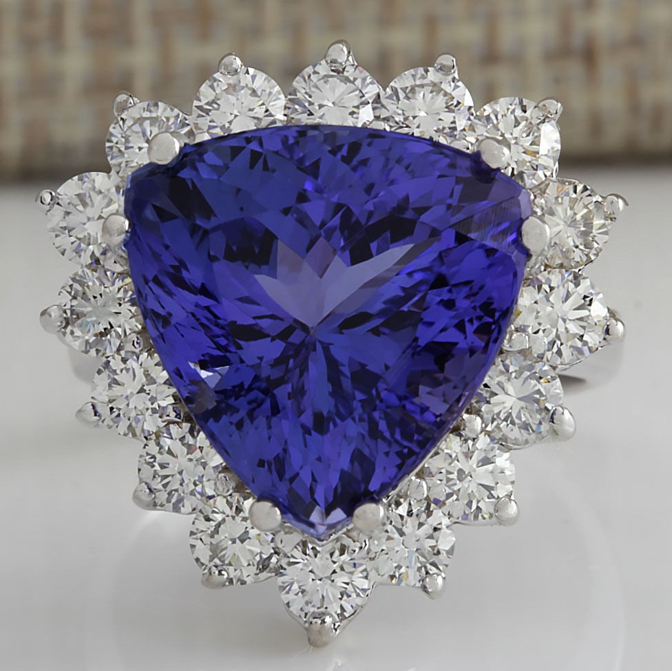 13.87 Carat Natural Blue Tanzanite And Diamond Ring 14K Solid White Gold: 13.87 Carat Natural Blue Tanzanite And Diamond Ring 14K Solid White Gold Stamped: 14K Ring Size: 6.5 Total Ring Weight: 10 Grams Diamond Weight: Total natural diamond weight is 2.00carat. VS2-SI1 clar