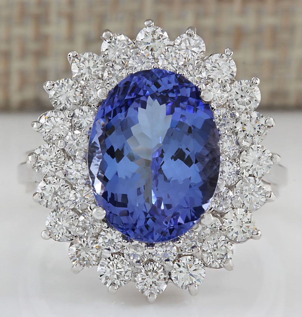 5.72Carat Natural Blue Tanzanite And Diamond Ring 18K Solid White Gold: 5.72Carat Natural Blue Tanzanite And Diamond Ring 18K Solid White Gold Stamped: 18K Ring Size: 6.25 Total Ring Weight: 6.5 Grams Diamond Weight: Total natural diamond weight is 1.60carat. VS2-SI1 clar