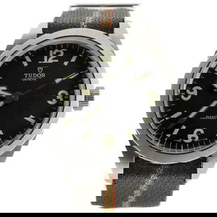 Tudor Ranger Automatic Watch Stainless Steel and Fabric 39: Tudor Ranger Automatic Watch Stainless Steel and Fabric 39 ---- Dial Color: Black ---- Band Color: Multi Color ---- Band Material: Canvas / Fabric ---- Case Material: Stainless Steel ---- Bezel Materi