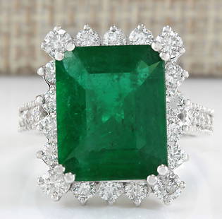 6.94Carat Natural Colombian Emerald And Diamond Ring In 18K White Gold: 6.94Carat Natural Colombian Emerald And Diamond Ring In 18K White Gold Stamped: 18K Ring Size: 7 Total Ring Weight: 8.3 Grams Diamond Weight: Total natural diamond weight is 1.50carat. VS2-SI1 clarity