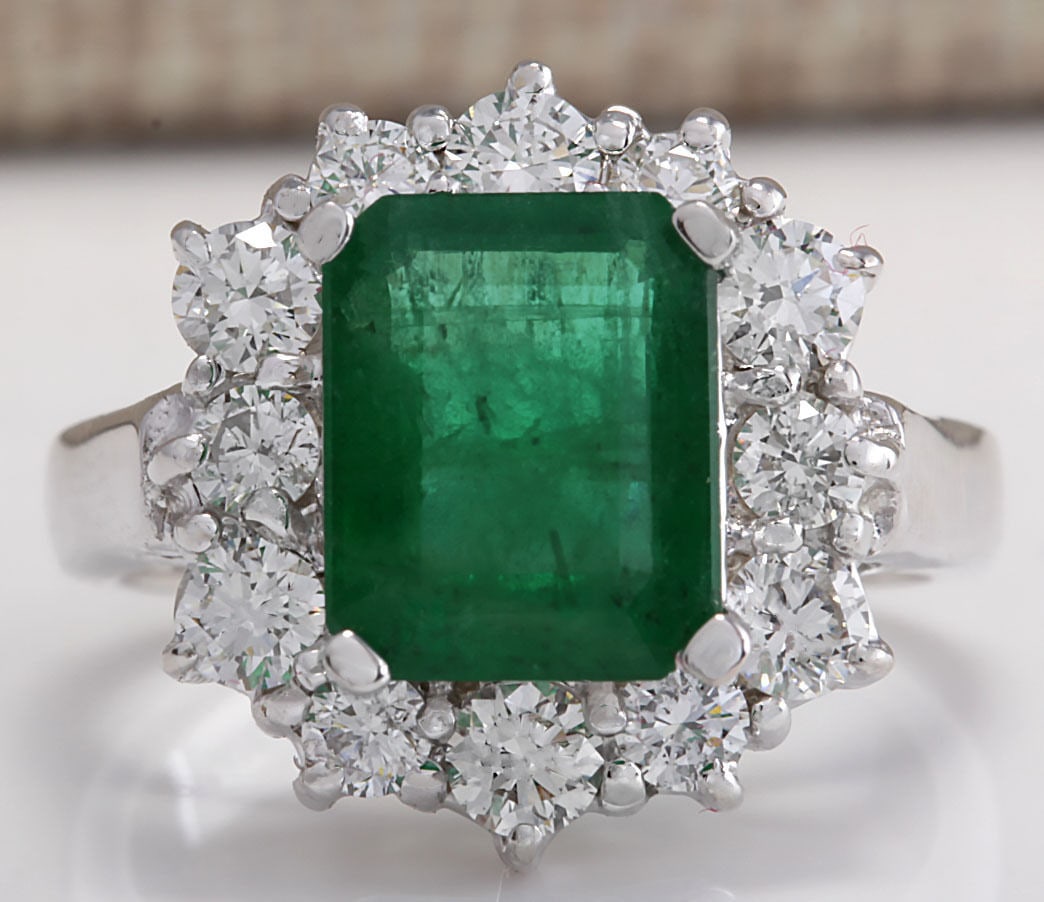 3.49Carat Natural Emerald And Diamond Ring 14K Solid White Gold: 3.49Carat Natural Emerald And Diamond Ring 14K Solid White Gold Stamped: 14K Ring Size: 5.26 Total Ring Weight: 6.6 Grams Diamond Weight: Total natural diamond weight is 1.05carat. VS2-SI1 clarity / F