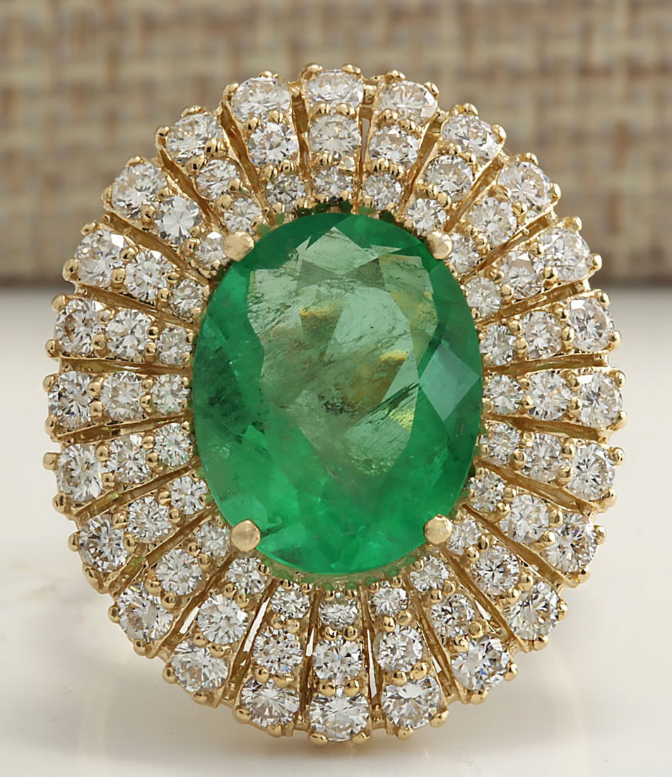 6.94Carat Natural Colombian Emerald And Diamond Ring 14K Solid Yellow Gold: 6.94Carat Natural Colombian Emerald And Diamond Ring 14K Solid Yellow Gold Stamped: 14K Ring Size: 6.25 Total Ring Weight: 6.5 Grams Diamond Weight: Total natural diamond weight is 1.60carat. VS2-SI1 
