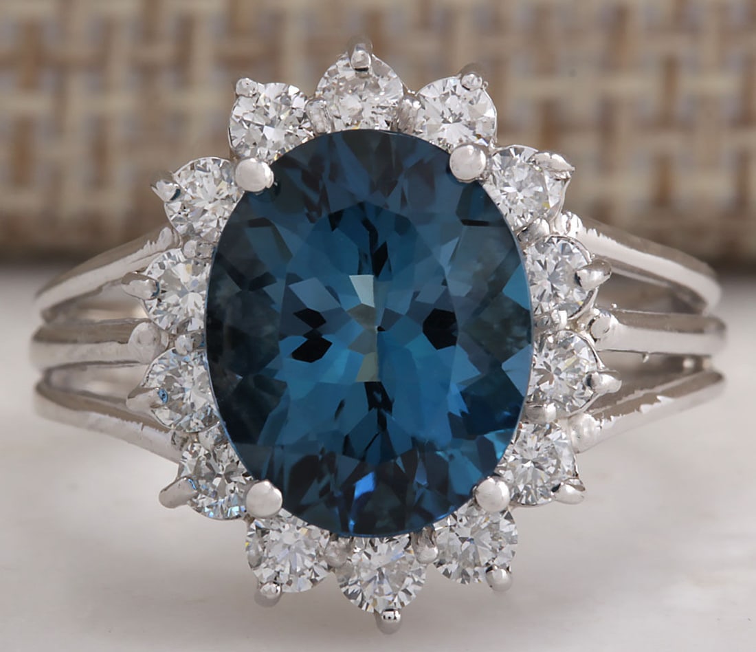 4.37Ct Natural London Blue Topaz And Diamond Ring In14K Solid White Gold: 4.37Ct Natural London Blue Topaz And Diamond Ring In14K Solid White Gold Stamped: 14K Ring Size: 6.5 Total Ring Weight: 4.1 Grams Diamond Weight: Total natural diamond weight is .70carat. VS2-SI1 clar