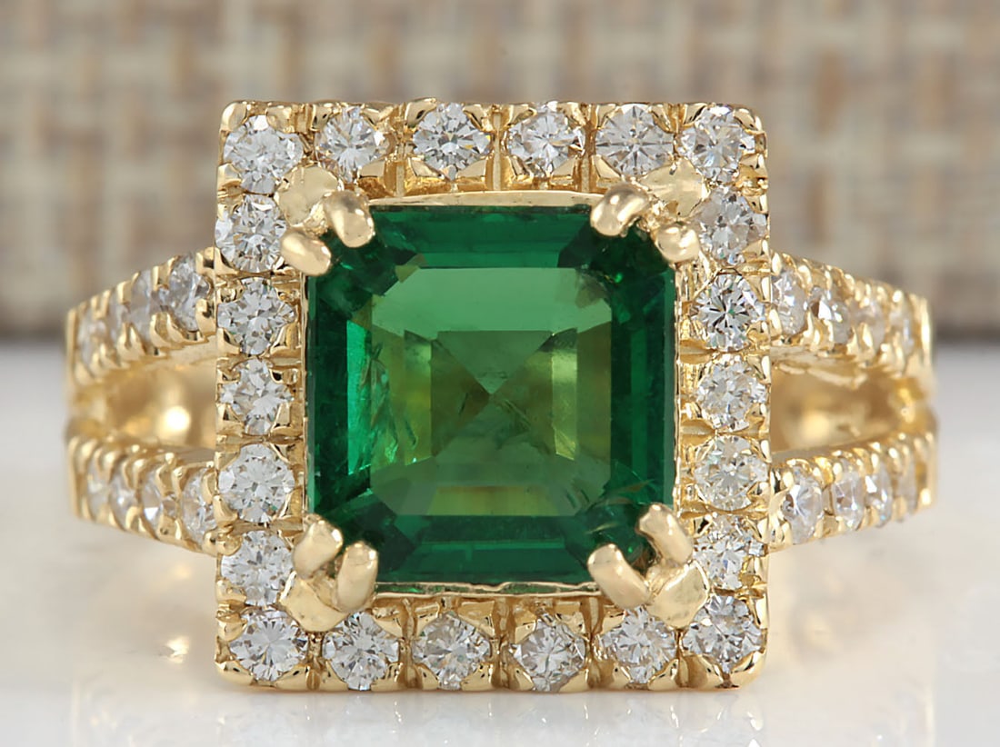 3.37Carat Natural Emerald And Diamond Ring In 14K Yellow Gold: 3.37Carat Natural Emerald And Diamond Ring In 14K Yellow Gold Stamped: 14K Ring Size: 6.25 Total Ring Weight: 8 Grams Diamond Weight: Total natural diamond weight is .80carat. VS2-SI1 clarity / F-G co