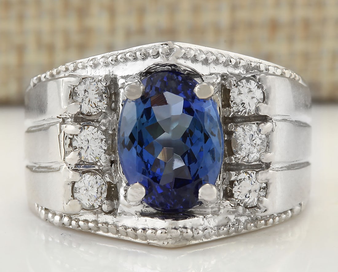 4.62Carat Natural Mens Tanzanite And Diamond Ring In 18K White Gold: 4.62Carat Natural Mens Tanzanite And Diamond Ring In 18K White Gold Stamped: 18K Ring Size: 8.5 Total Ring Weight: 14 Grams Diamond Weight: Total natural diamond weight is .60carat. VS2-SI1 clarity / 