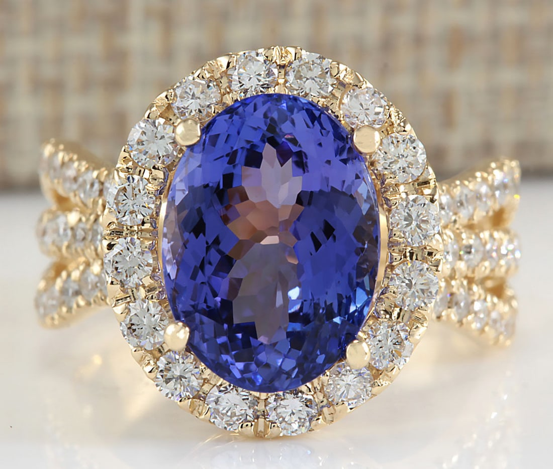 7.18 Carat Natural Tanzanite And Diamond Ring 14K Solid Yellow Gold: 7.18 Carat Natural Tanzanite And Diamond Ring 14K Solid Yellow Gold Stamped: 14K Ring Size: 7.25 Total Ring Weight: 8 Grams Diamond Weight: Total natural diamond weight is 1.45carat. VS2-SI1 clarity /