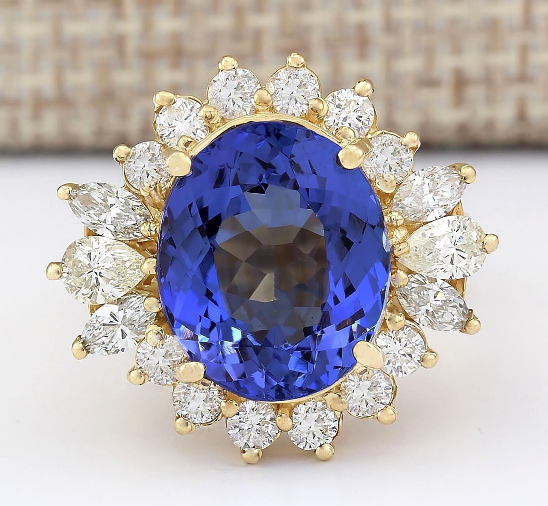 10.64 Carat Natural Tanzanite And Diamond Ring In 14k Yellow Gold: 10.64 Carat Natural Tanzanite And Diamond Ring In 14k Yellow Gold Stamped: 14K Ring Size: 6 Total Ring Weight: 10 Grams Diamond Weight: Total natural diamond weight is 3.00carat. VS2-SI1 clarity / G-H