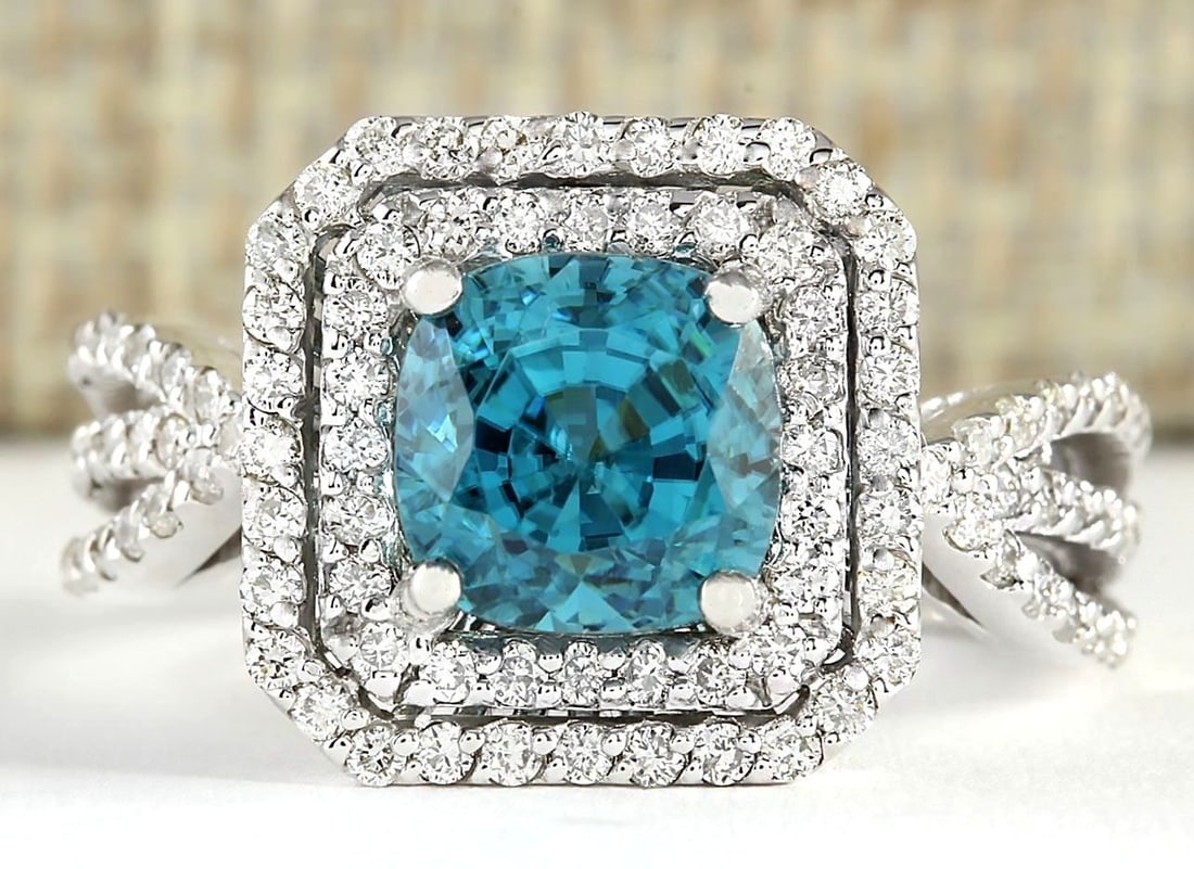 5.46 Carat Natural Blue Zircon And Diamond Ring 14k Solid White Gold: 5.46 Carat Natural Blue Zircon And Diamond Ring 14k Solid White Gold Stamped: 14K Ring Size: 6.75 Total Ring Weight: 5.5 Grams Diamond Weight: Total natural diamond weight is .75carat. VS2-SI1 clarity