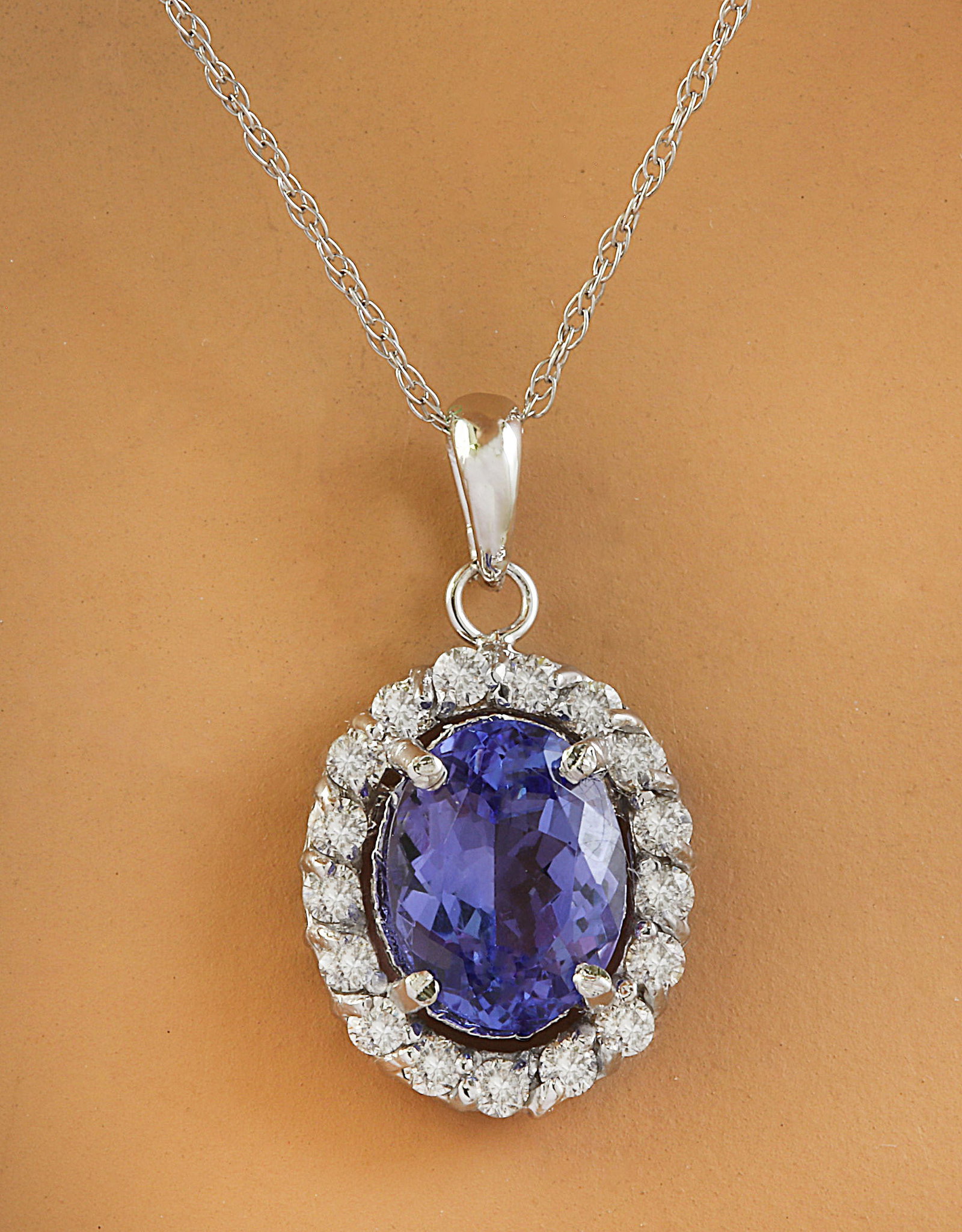 2.00 Carat Tanzanite 14K White Gold Diamond Necklace: 2.00 Carat Tanzanite 14K White Gold Diamond Necklace Stamped: 14K Total Necklace Weight: 1.4 Grams Necklace Length 18 Inches Tanzanite Weight: 1.65 Carat (9.00x7.00 Millimeters) Diamond Weight: 0.35 C