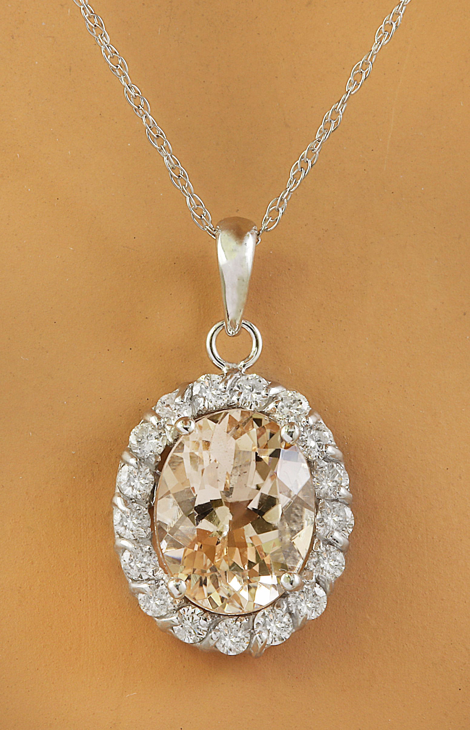 2.00 Carat Morganite 14K White Gold Diamond Necklace: 2.00 Carat Morganite 14K White Gold Diamond Necklace Stamped: 14K Total Necklace Weight: 1.4 Grams Necklace Length 18 Inches Morganite Weight: 1.65 Carat (9.00x7.00 Millimeters) Diamond Weight: 0.35 C