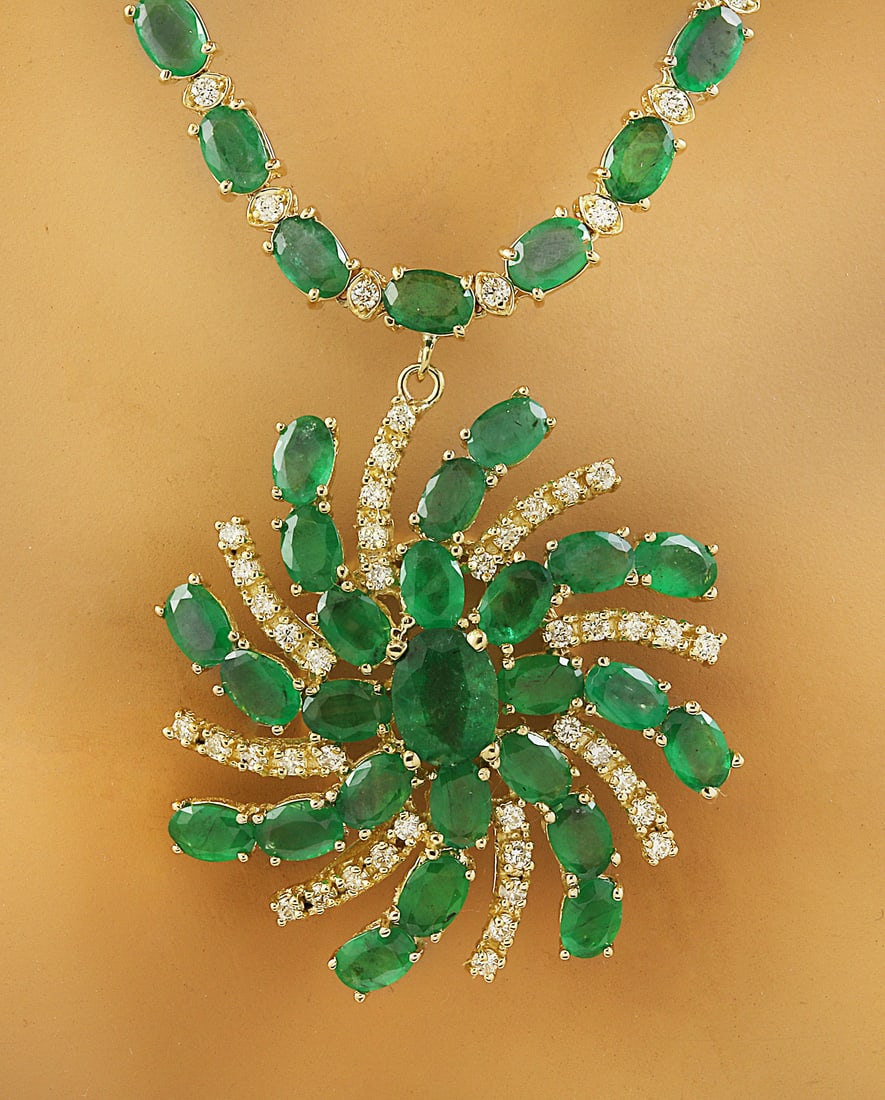 38.50 Carat Emerald 18K Yellow Gold Diamond Necklace: 38.50 Carat Emerald 18K Yellow Gold Diamond Necklace Stamped: 18K Total Necklace Weight: 36.3 Grams Necklace Length: 18 Inches Center Emerald Weight: 1.50 Carat (9.00x7.00 Millimeters) Side Emerald We