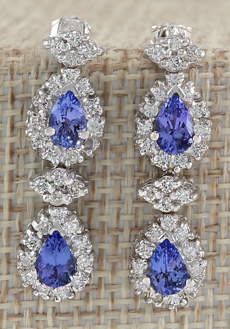 3.16Carat Natural Blue Tanzanite And Diamond Earrings In 14K White Gold: 3.16Carat Natural Blue Tanzanite And Diamond Earrings In 14K White Gold Stamped: 14K Length: 11.20 inch Total Ring Weight: 6.7 Grams Diamond Weight: Total natural diamond weight is 1.36carat. VS2-SI1 