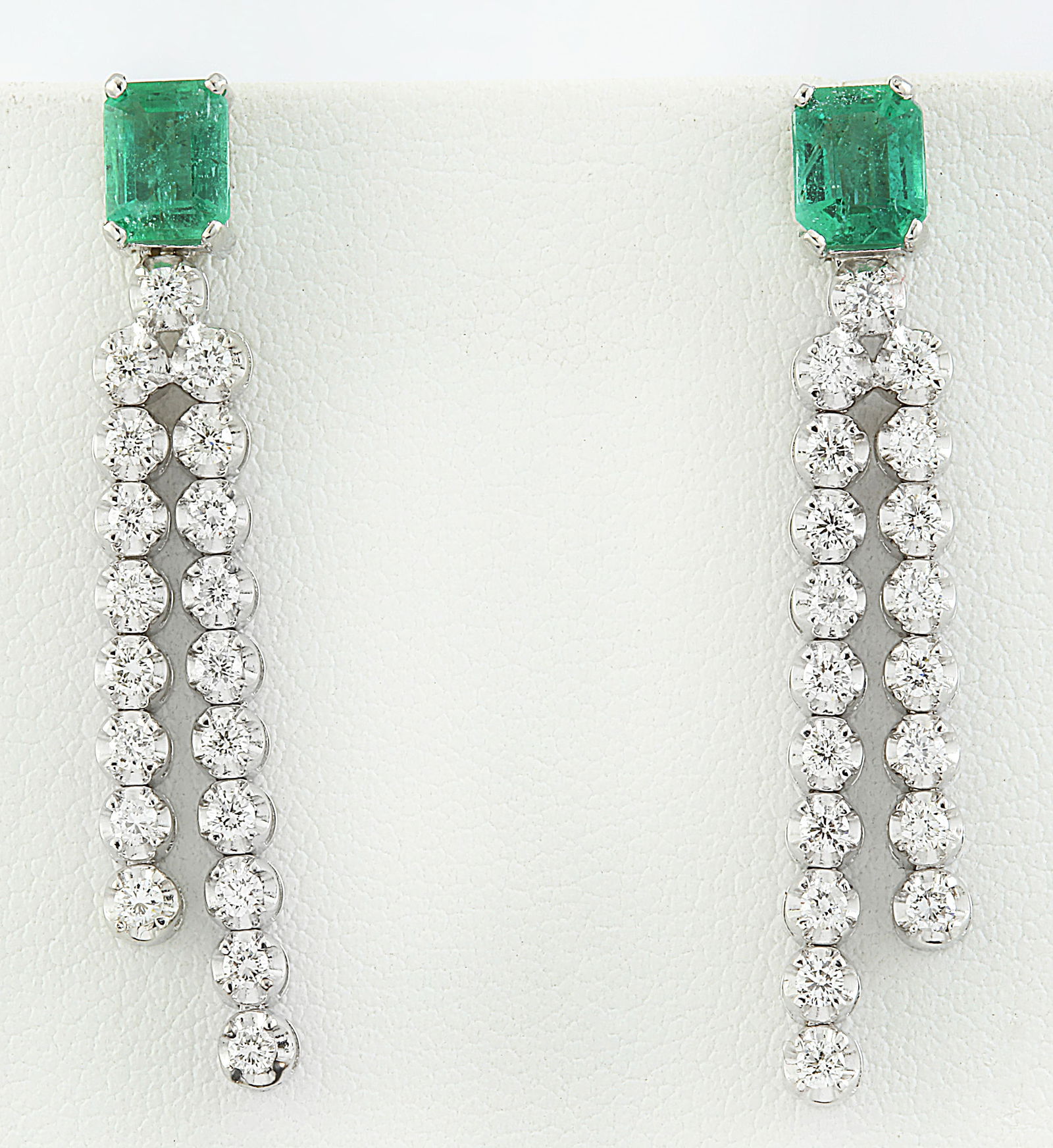 2.10 Carat Emerald 18K White Gold Diamond Earrings: 2.10 Carat Emerald 18K White Gold Diamond Earrings Stamped: 18K Total Earrings Weight: 4.5 Grams Emerald Weight: 1.30 Carat (6.00x4.00 Millimeters) Diamond Weight: 0.80 Carat (F-G Color, VS2-SI1 Clari