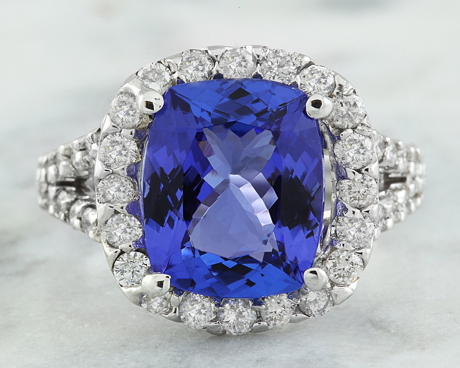 5.09 Carat Tanzanite 18K White Gold Diamond Ring: 5.09 Carat Tanzanite 18K White Gold Diamond Ring Stamped: 18K Total Ring Weight: 5.8 Grams Tanzanite Weight: 4.00 Carat (10.80x9.00 Millimeters) Diamond Weight: 1.09 Carat (F-G Color, VS2-SI1 Clarity 