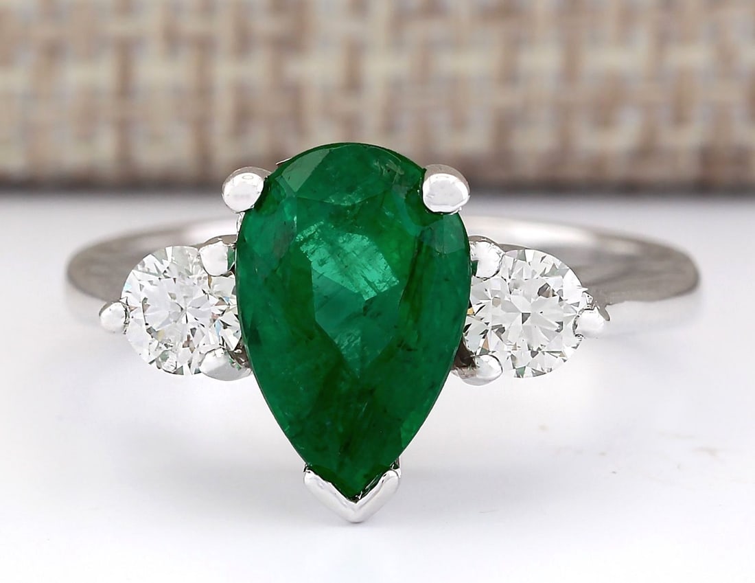 3.03 Carat Natural Emerald And Diamond Ring In 18K White Gold: 3.03 Carat Natural Emerald And Diamond Ring In 18K White Gold Stamped: 18K Ring Size: 6.25 Total Ring Weight: 5.1 Grams Diamond Weight: Total natural diamond weight is .50carat. VS2-SI1 clarity / G-H 