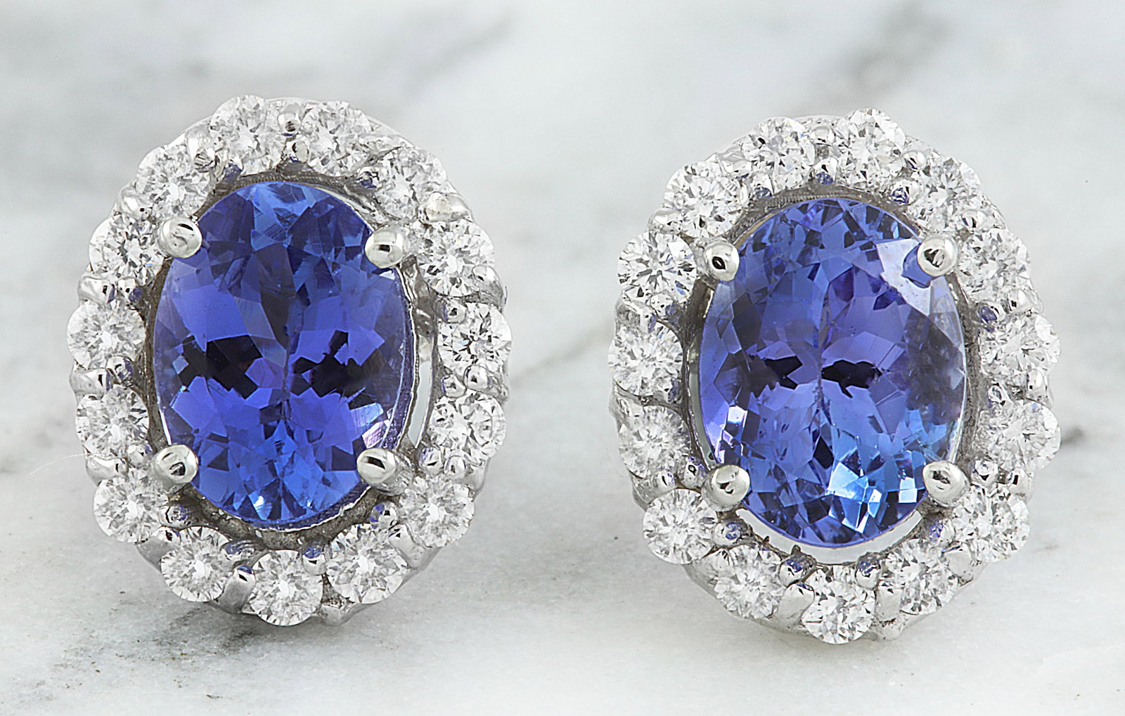 3.07 Carat Tanzanite 18K White Gold Diamond Earrings: 3.07 Carat Tanzanite 18K White Gold Diamond Earrings Stamped: 18K Total Earrings Weight: 2.1 Grams Tanzanite Weight: 2.37 Carat (7.60x5.90 Millimeters) Diamond Weight: 0.70 Carat (F-G Color, VS2-SI1 C