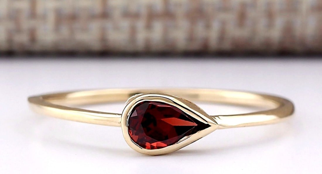 .50 Carat Natural Rhodolite Garnet Ring In 18K Yellow Gold: .50 Carat Natural Rhodolite Garnet Ring In 18K Yellow Gold Stamped: 18K Ring Size: 7.5 Total Ring Weight: 1.1 Gram Gemstone Weight: Total Natural Garnet Weight is .50ctw Main Stone Color: Red Face Mea